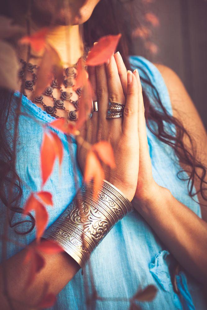 Anjali mudra hands pressed together in serenity and mindfulness.
