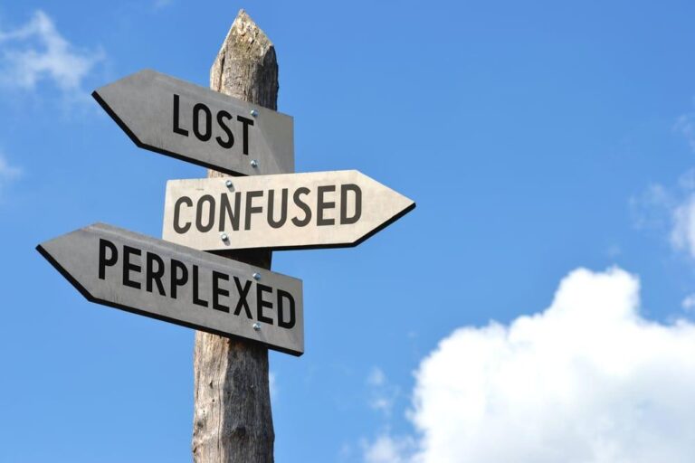 Signs at a crossroads: Lost, Confused, Perplexed.