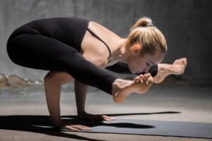 Advanced yoga pose demonstrating strength and flexibility.