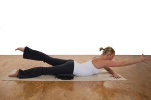 Gentle yoga pose for relieving low back discomfort and improving flexibility.