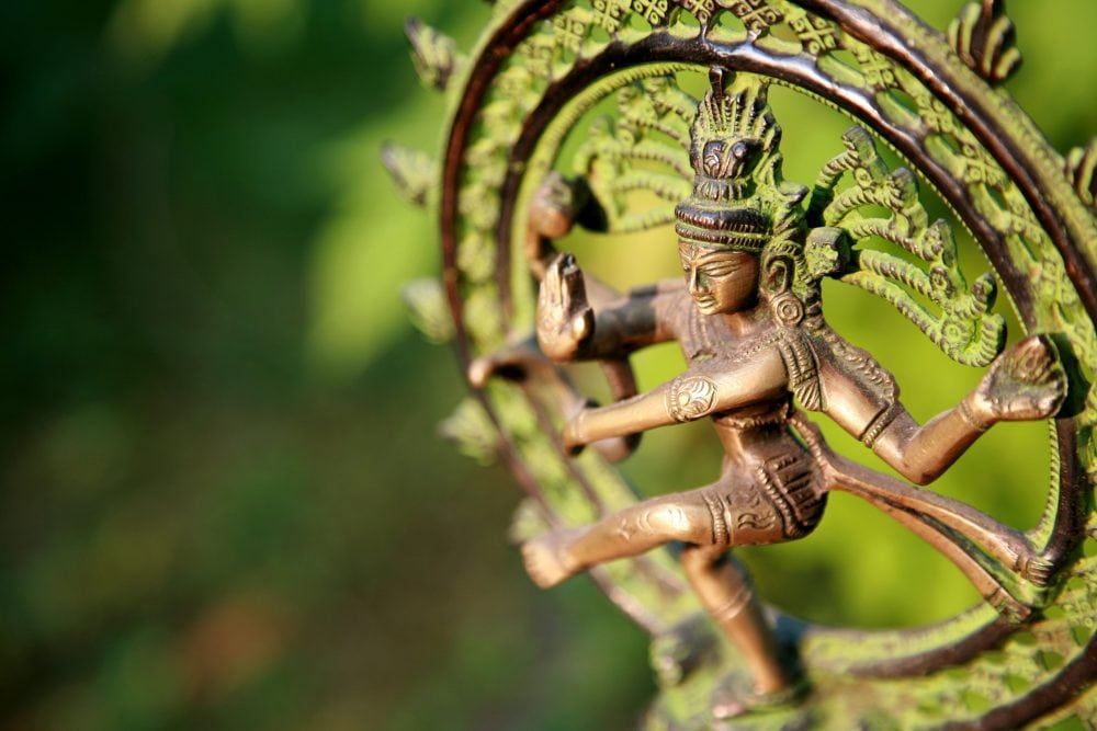 Bronze dancing Shiva figurine showcasing intricate craftsmanship and vibrant details.