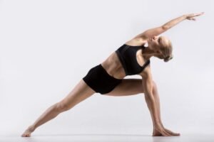 Yoga stretching pose for flexibility and strength improvement.