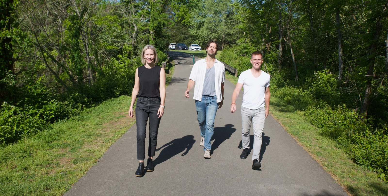 Group enjoying a nature walk on a sunny day.