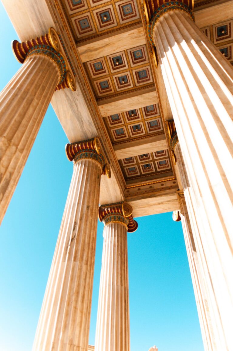 Majestic columns under a clear blue sky, showcasing architectural beauty.